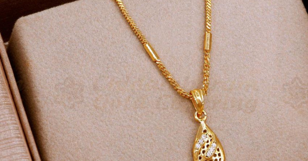 Gold chain with white enamel and cz stones pendant